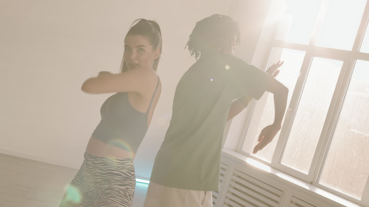 Performers Dancing Back to Back