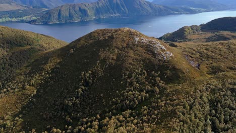 Aerial-over-the-rugged-hills-and-lakes-near-Lauvstad-in-the-Volda-Municipality,-Norway