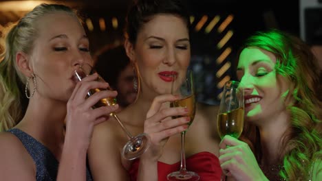 female friends toasting champagne