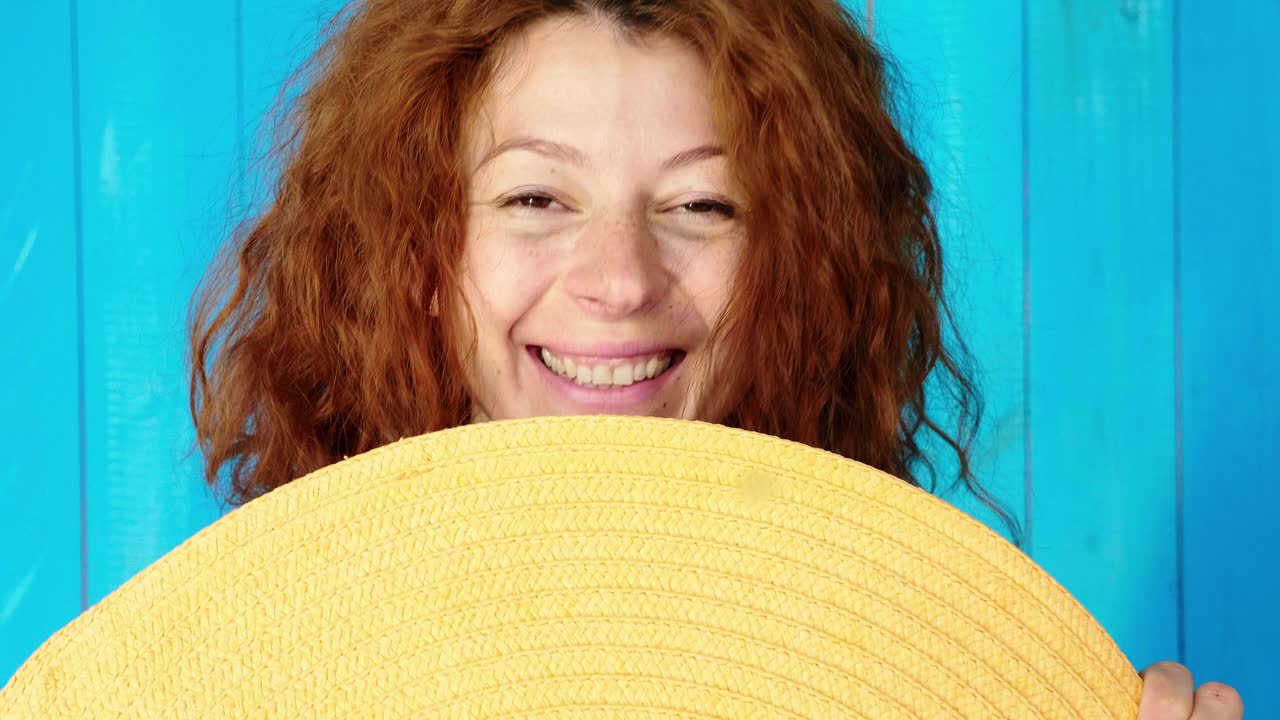 Smiling Woman with a Straw Hat