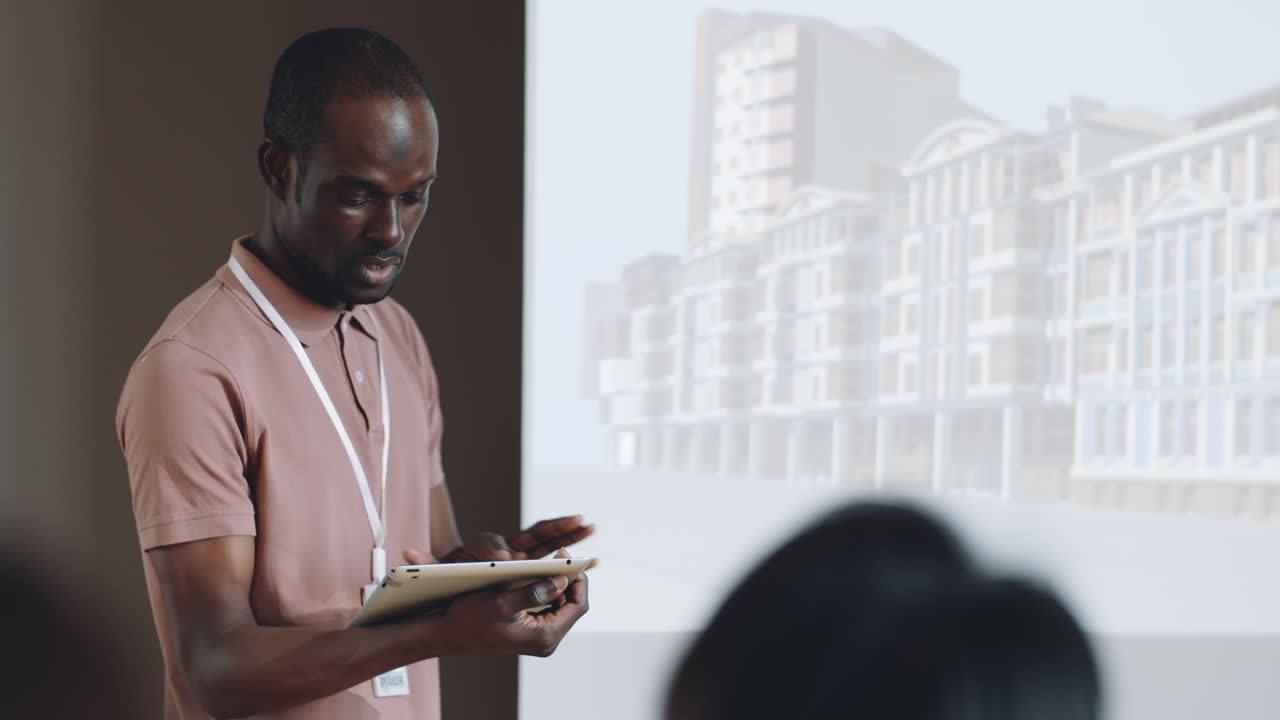 Black Man Presenting Architectural Project on Business Conference