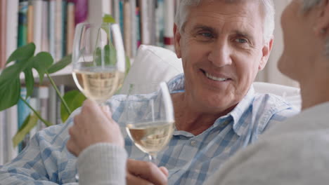 happy-old-couple-drinking-wine-relaxing-on-sofa-at-home-making-toast-celebrating-anniversary-enjoying-romantic-relationship-on-comfortable-retirement-4k-footage