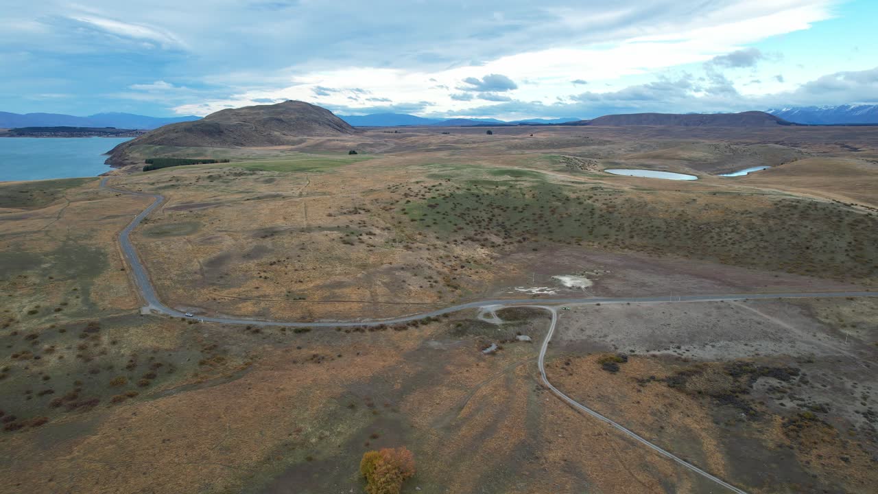 Road Along The Plains In Tekapo Near The Lake In Canterbury, South Island, NZ. - aerial shot