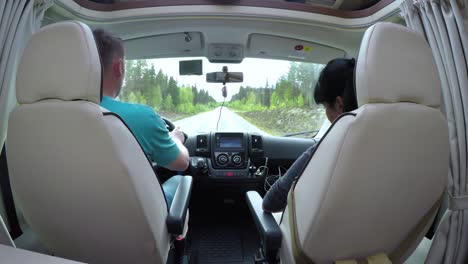 man driving on a road in the camper van rv