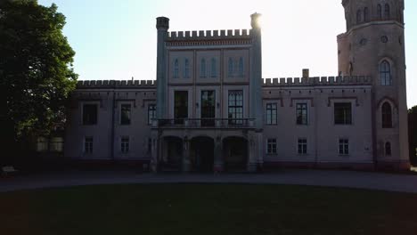 Vecauce-Manor-in-Latvia-Aerial-View-of-the-Pink-Castle-Through-the-Park