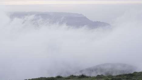 time-lapse clouds, sight from the peak of the mountain, foggy atmosphere, landscape, spain, static shot