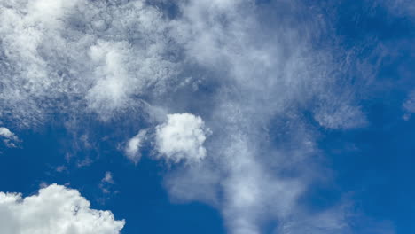 speed movement of white clouds against blue sky on sunny day