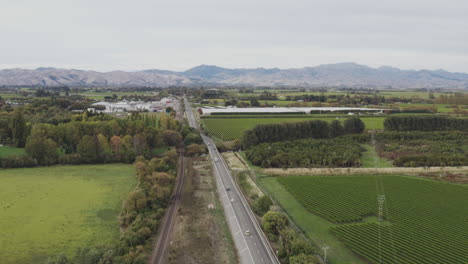 Aerial-drone-shot-of-the-highway-going-through-the-Marlborough-wine-region-in-New-Zealand