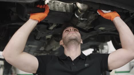 mechanic working under car