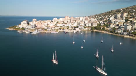 Aerial-Boom-Shot-Reveals-Port-of-Saranda-on-Typical-Summer-Day-in-Albania