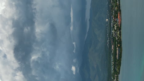 dramatic cloudscape over the ouemo peninsula of noumea, new caledonia - vertical time lapse