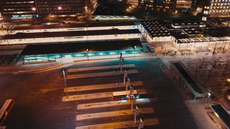 Aerial-hyperlapse-showing-buildings,-cars-and-city-landscape