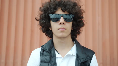 teenage boy wearing sunglasses