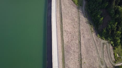 Aerial-upwards-shot-of-Road-diving-water-and-land-where-reservoir-is