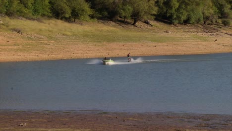 water skiing in a blue lake