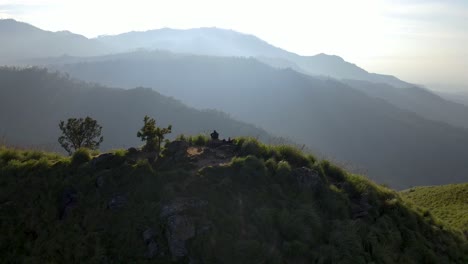 Aerial-drone-rotating-shot-over-winding-path-leading-upto-Little-Adams-peak-in-Sri-Lanka-on-a-bright-sunny-morning