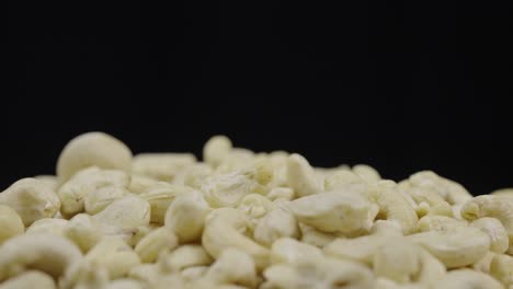 close-up of cashew nuts on black background