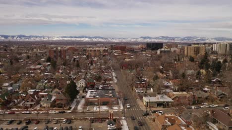 I-scenic-reverse-pan-of-the-rockies-while-flying-over-Denver,-Colorado