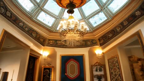 a luxurious interior design with gold ornaments and a chandelier