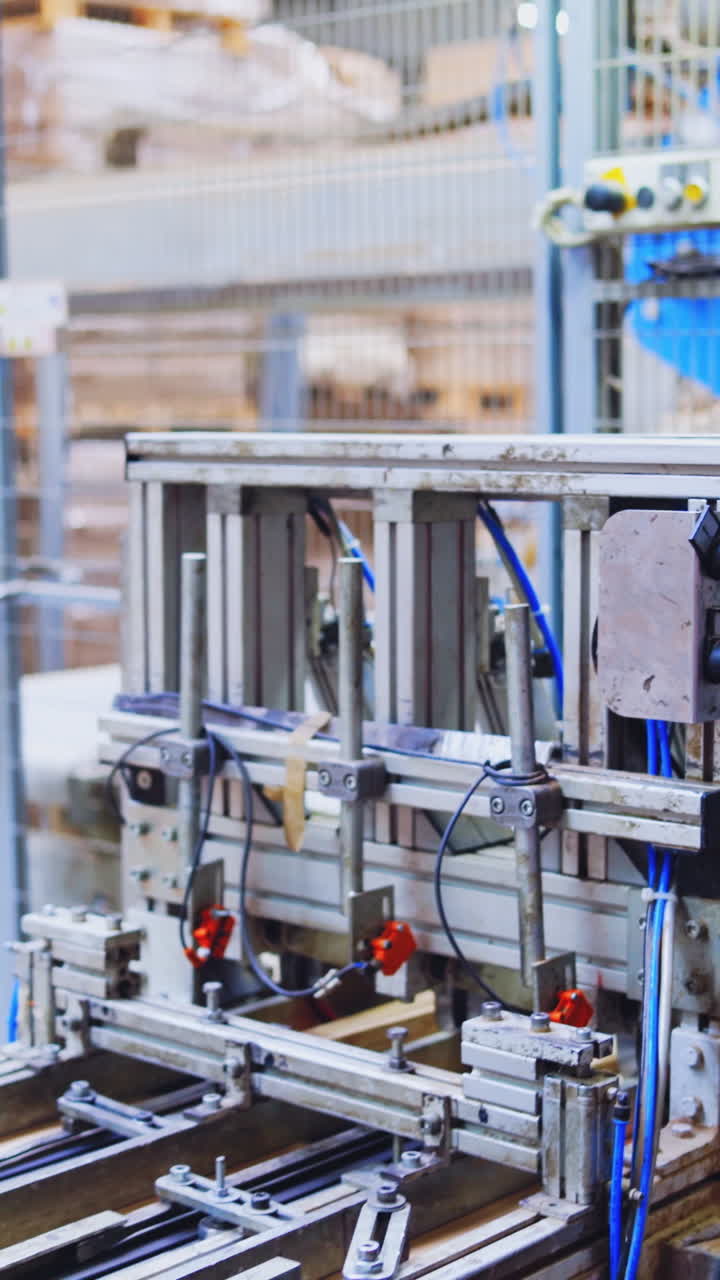Automated equipment in a woodworking plant. Interior of a modern robotic factory of parquet production. Vertical video