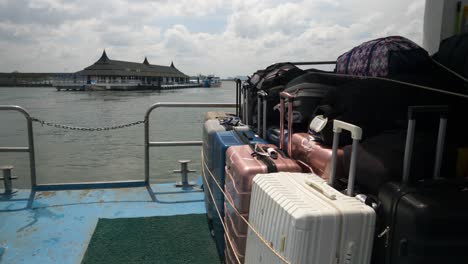 luggage on a traveling ferry going to koh phi phi island from krabi town port in thailand. close-up shot