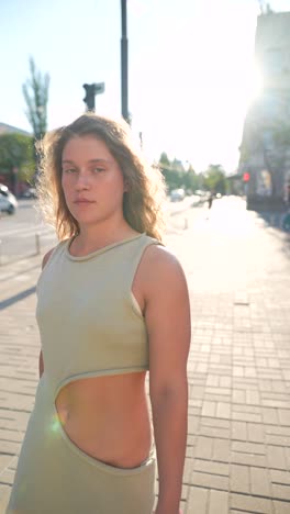 young woman walking in city street