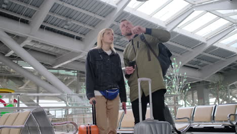 couple waiting at airport terminal