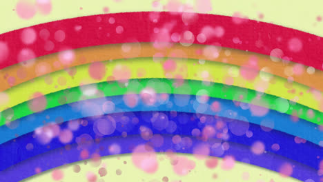 animation of bright rainbow with multiple pink flickering spots