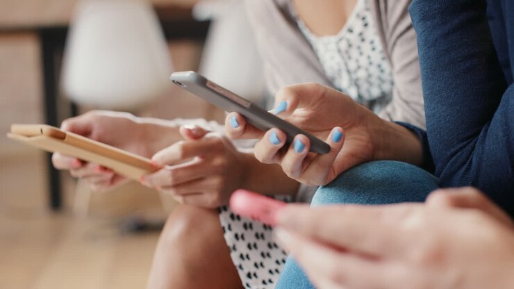 Friends at home using smart phones social media