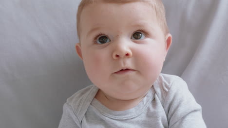 portrait happy baby smiling looking curious infant enjoying life 4k footage