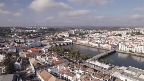 aerial view of charming tavira town with river gilao and bridges spanning it