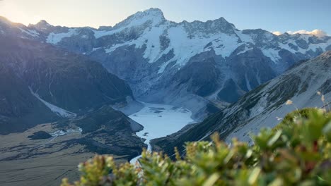 sunset over alpine mueller lake, mt cook, new zealand