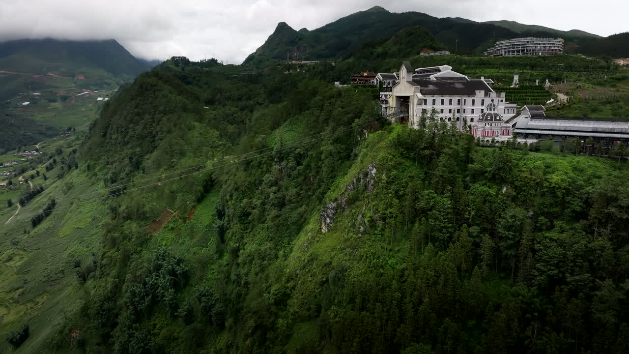 Sun World fansipan Legend cable car station in the middle of mountains, Sapa Town valley, Drone shot
