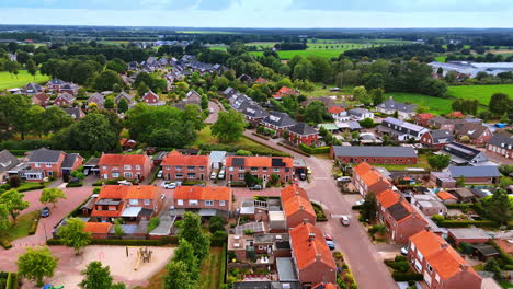 Bright suburban scene, afternoon. Aerial view of a vibrant suburb with green lawns, red roofs, and winding roads in afternoon light
