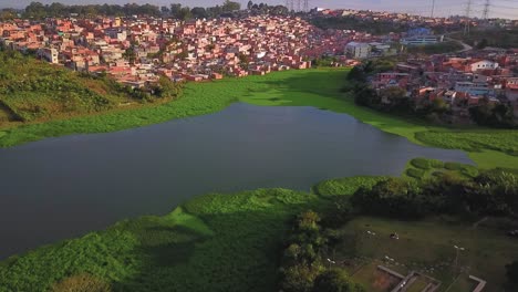 Beautiful-aerial-view-descending-over-the-Sao-Paulo-favelas-and-water-reserve