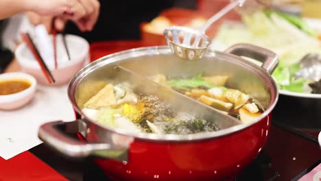 cooking and sharing hotpot meal together