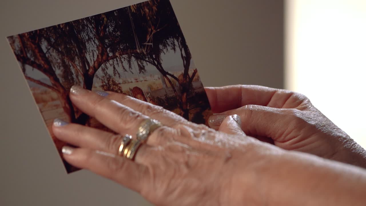 Aged hands on the photo.