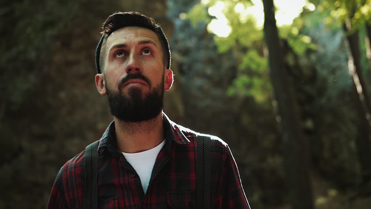 Portrait of a bearded lumberjack with an axe