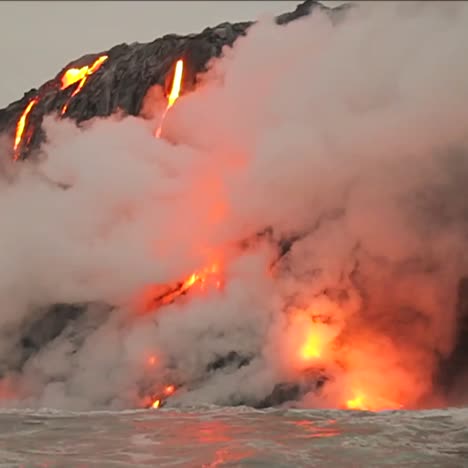 Spectacular-dusk-lava-flow-from-a-volcano-into-ocean