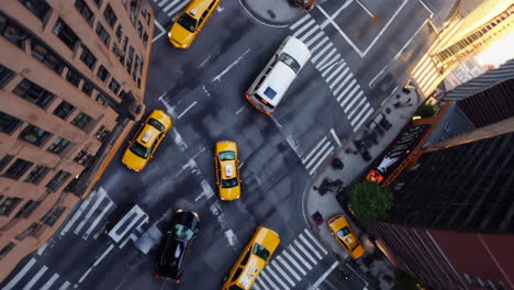 aerial view of urban traffic with yellow taxis