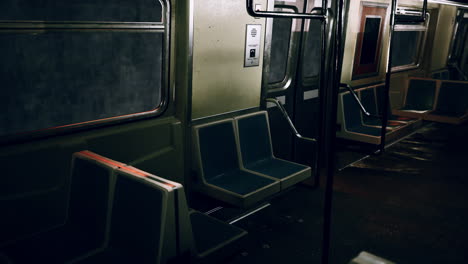 empty subway car with seats and handrails