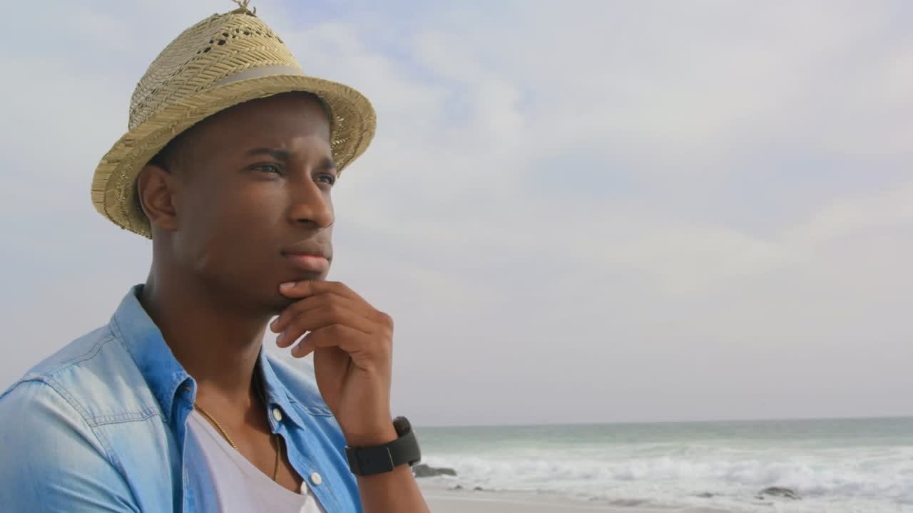 Animering av afroamerikansk man vid havet över USA:s flagga