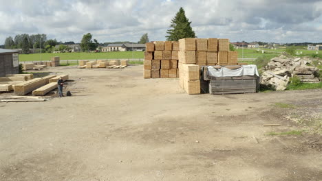 drone flight towards wood material stack