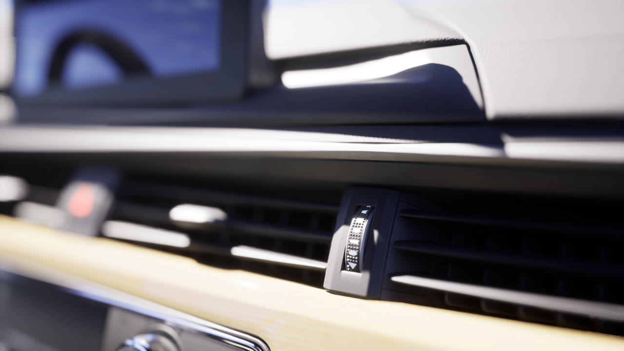 Close view of modern car dashboard control features during daylight