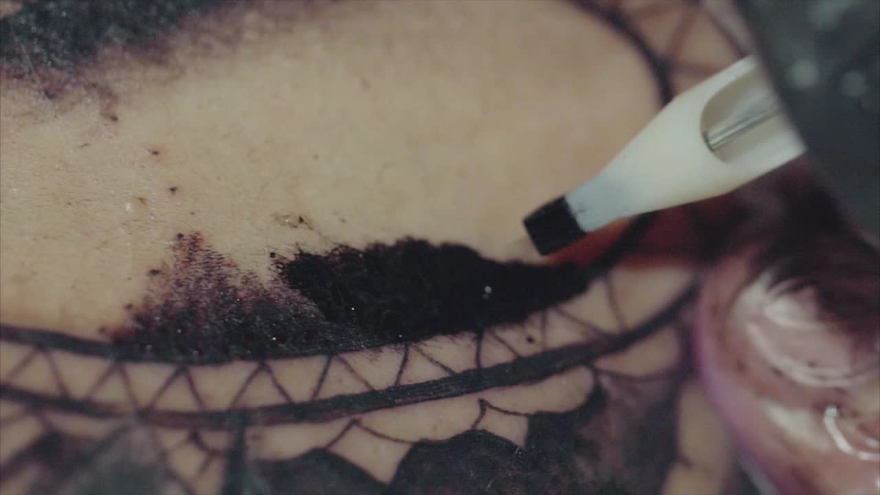 Tattooing in progress