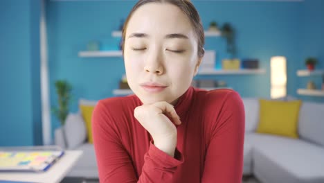 Young-Asian-woman-looking-at-camera-seriously.