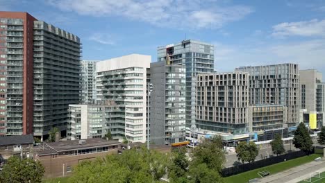 Drone-flying-up-over-downtown-Toronto-neighborhood-on-a-summer-day