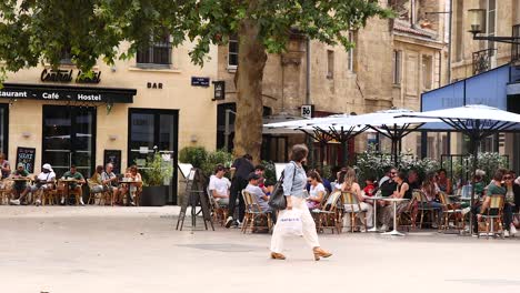 people enjoying outdoor café in bordeaux, france