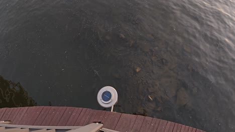 walking on wooden bridge overlooking han river in seoul, south korea. overhead shot, pov