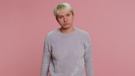 tired serious upset young woman with short hair showing pause gesture, limit or stop sign, time out